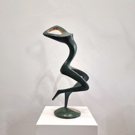 bronze figurative indoor sculpture in black green