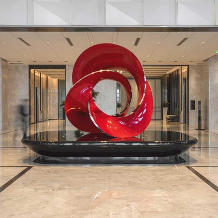 large abstrract sculpture in red