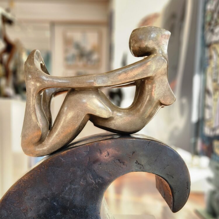 surfer sculpture bronze wave