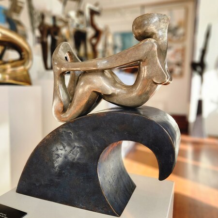 surfer sculpture bronze wave