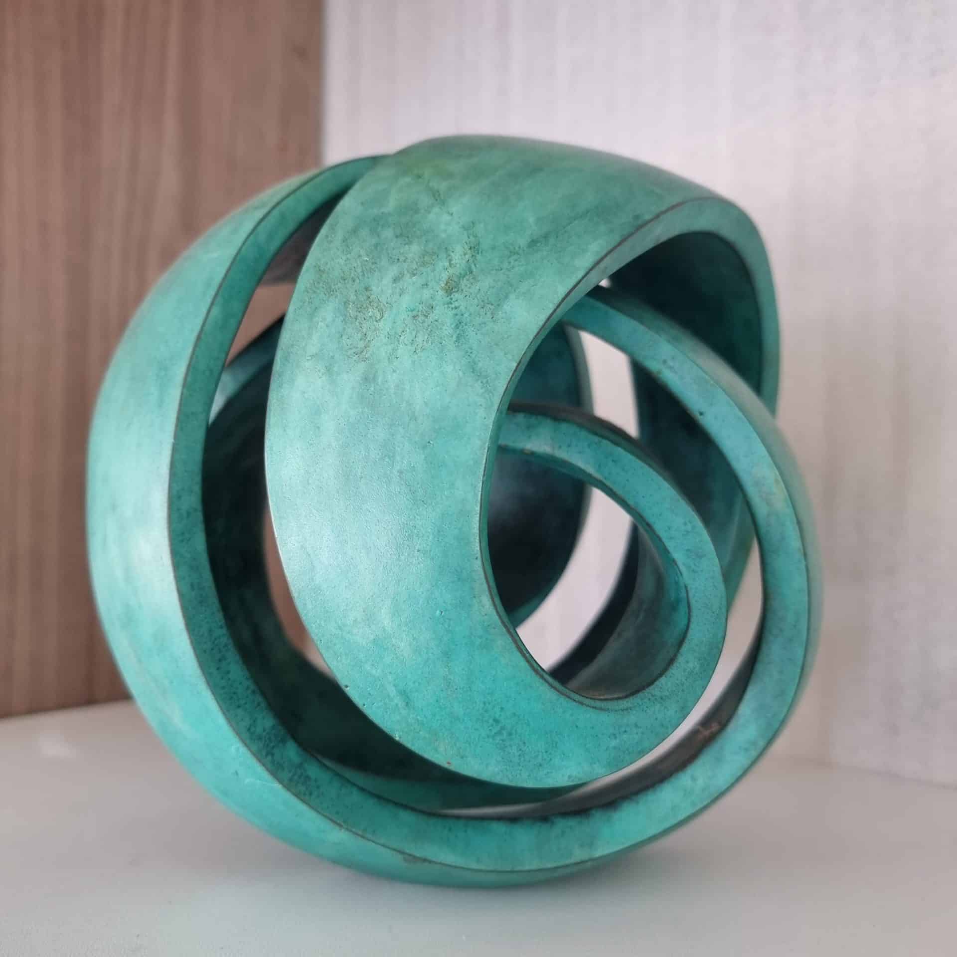 bronze green round sculpture
