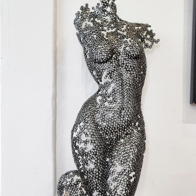 metal female body sculpture