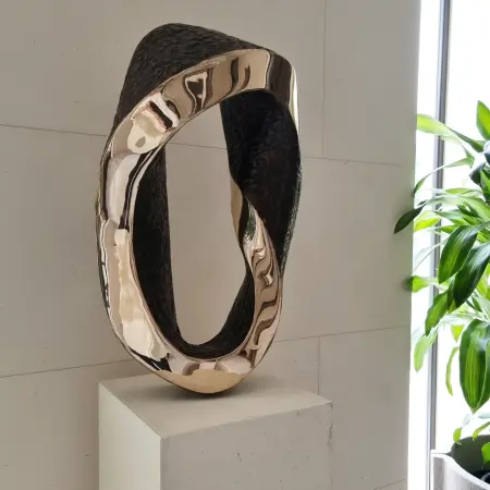 polished bronze sculpture - Mobius Curve